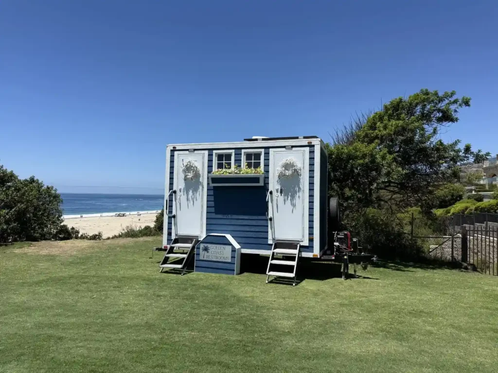 Luxury porta potty positioned at an outdoor event venue in Hillcrest, CA.