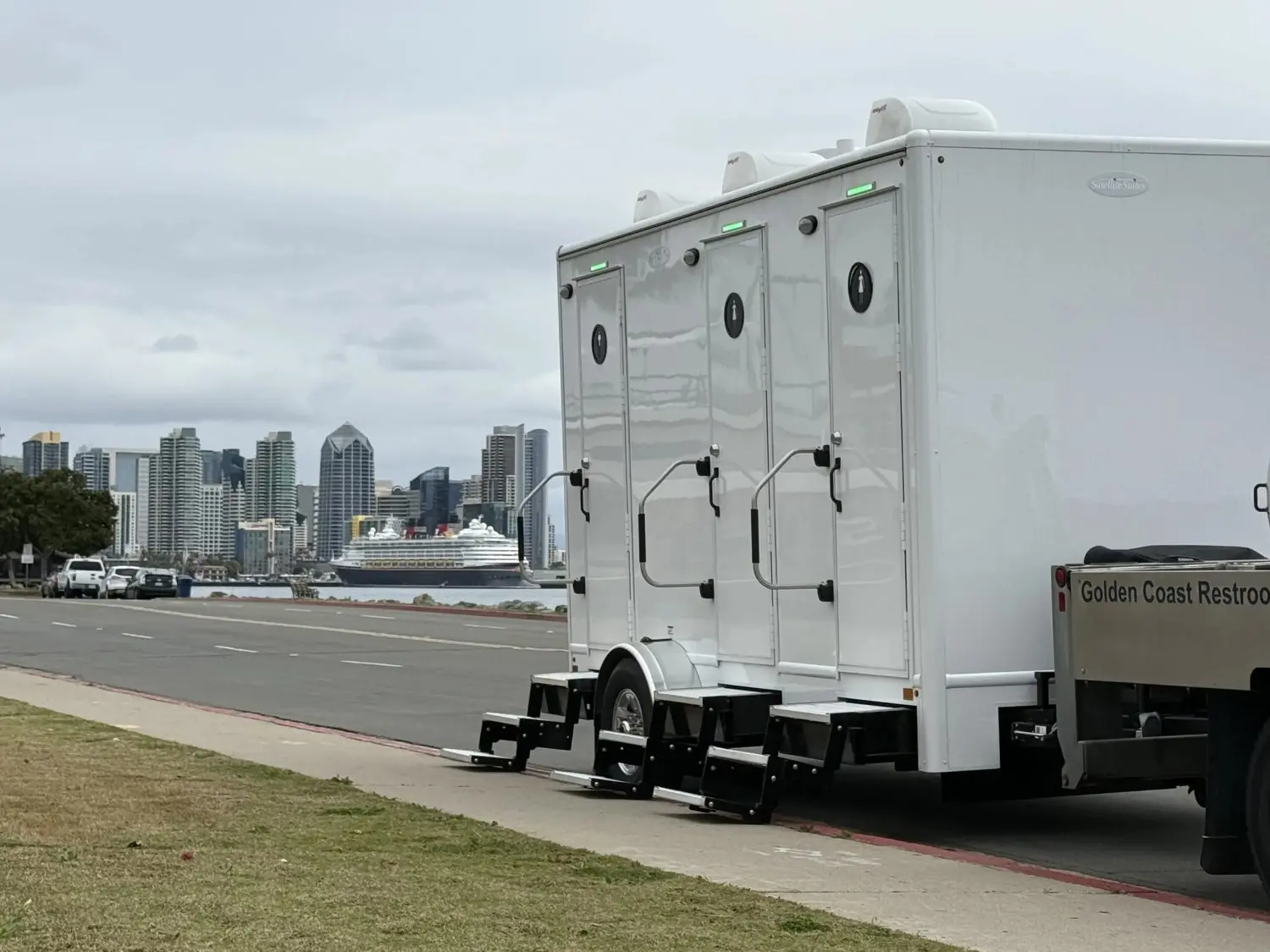 Premium portable restroom set beside an outdoor event space in North Park, CA.