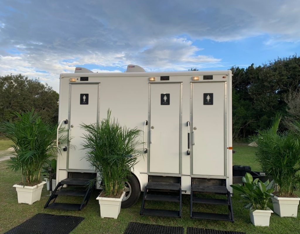 Outdoor luxury porta potty installed efficiently by Golden Coast team