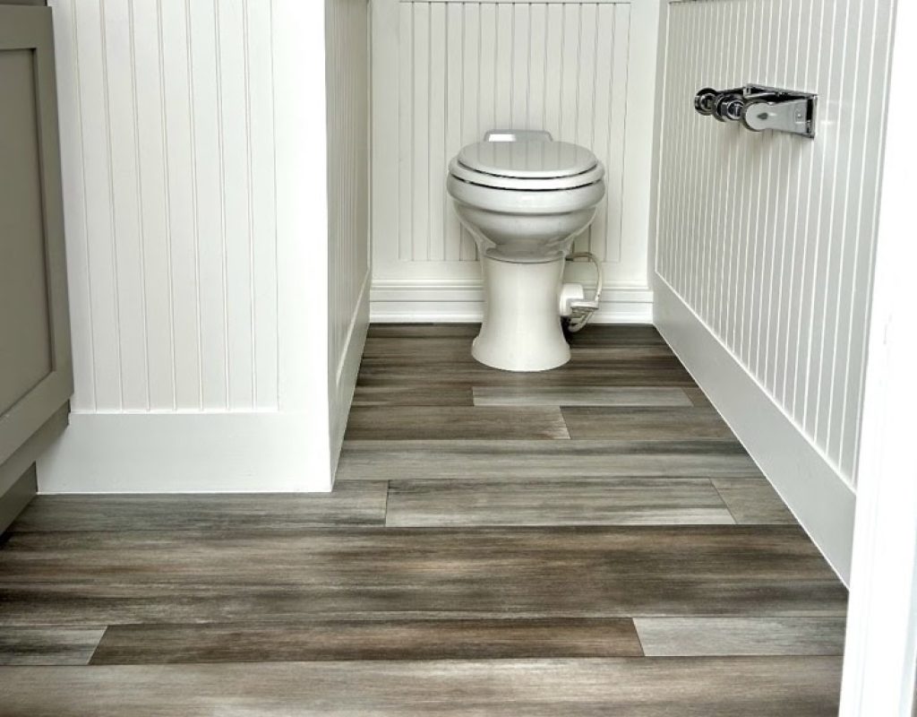 Golden Coast Restrooms setting up premium portable toilet facilities outdoors