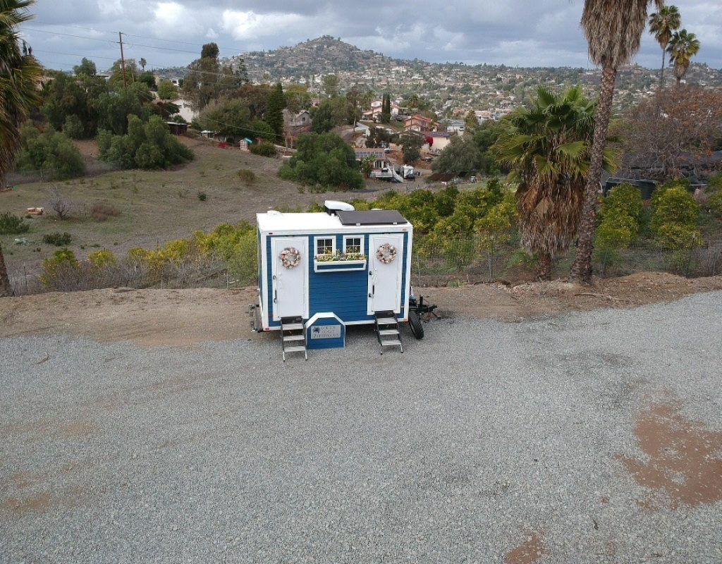 Reliable luxury porta potty placed at construction site by team