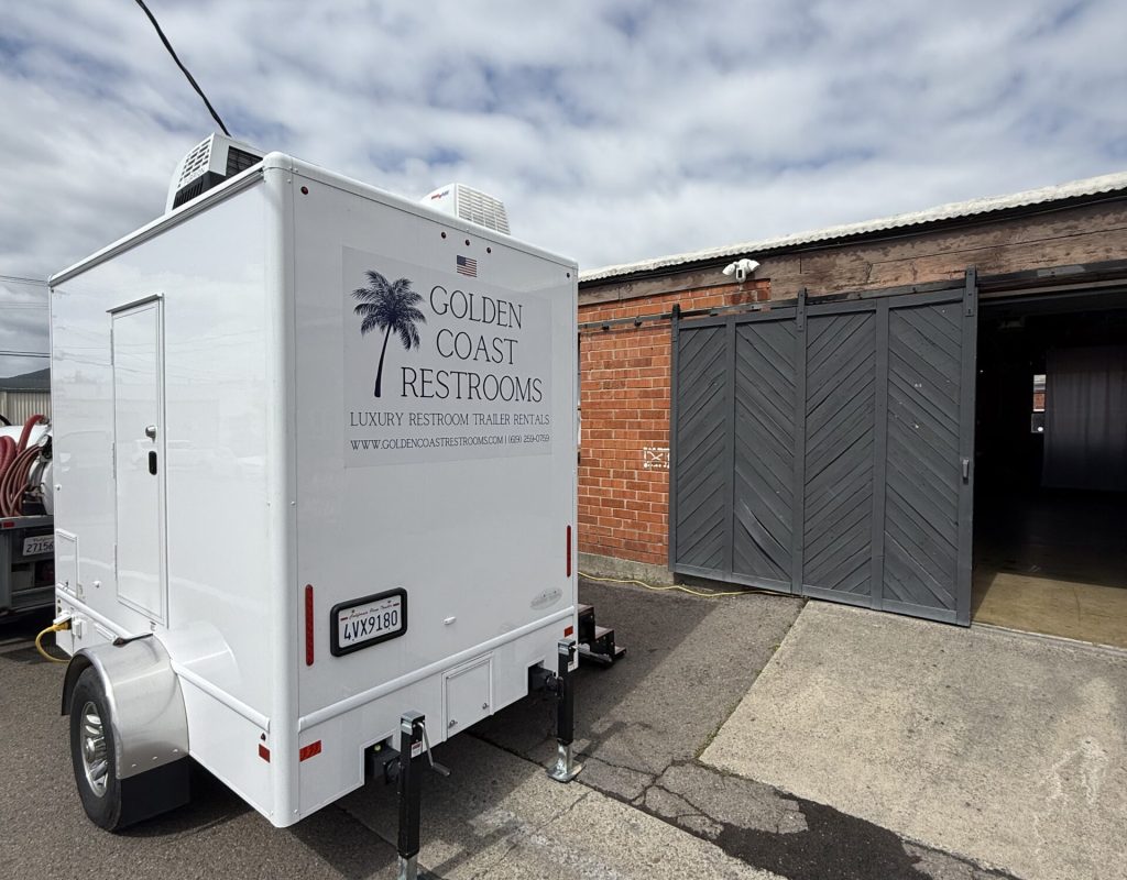 Premium luxury porta potty at outdoor event by Golden Coast Restrooms