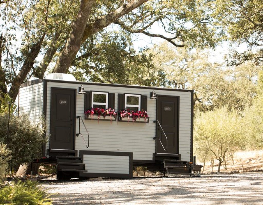 Outdoor luxury porta potty installed efficiently by Golden Coast team